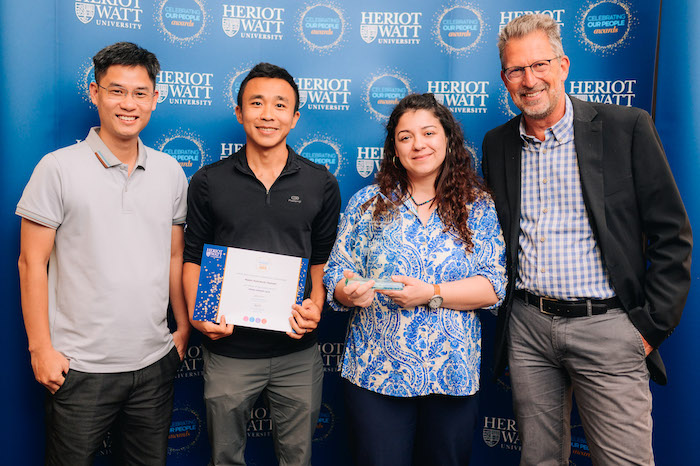 Winner of the Inspire Award, Dr Inna Yaneva-Toraman and her team from the Lyell Centre Four individuals smiling as they receive an award.
