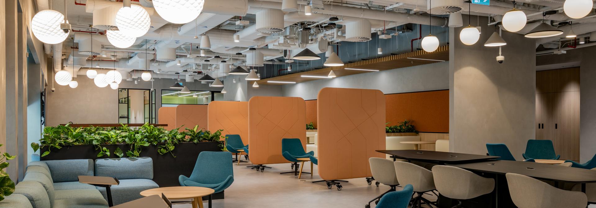 lounge with multiple colorful seats and movable dividers with low benches