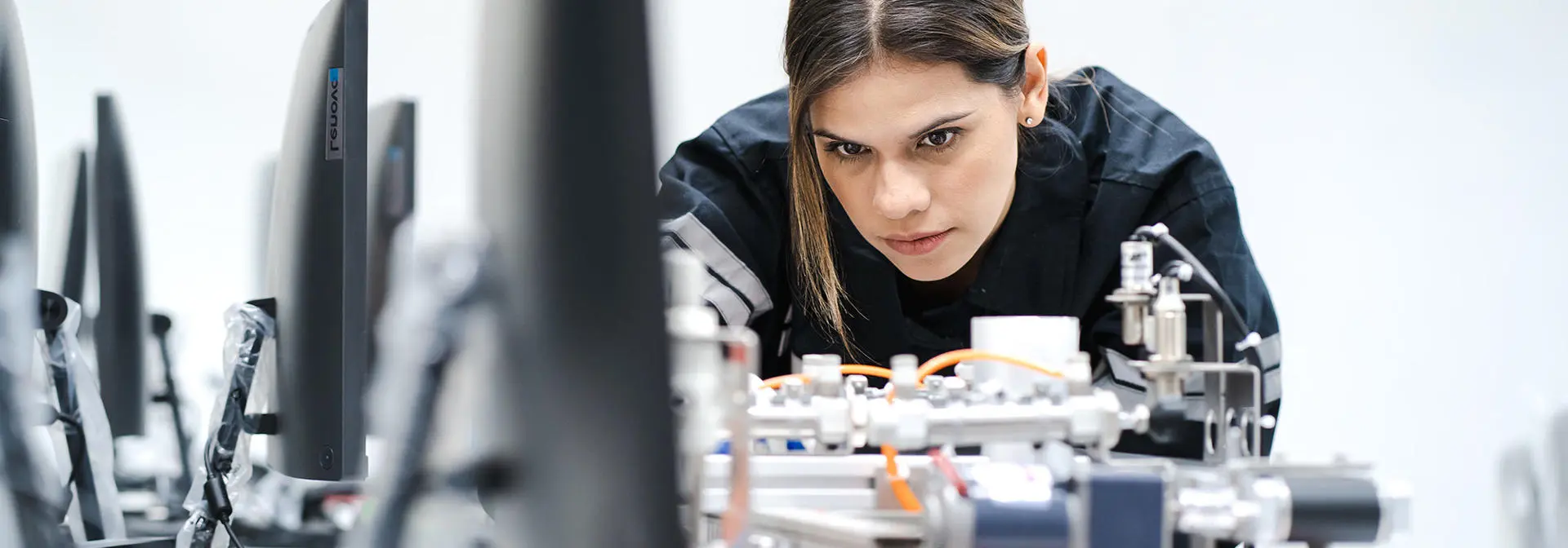 A student works on a device in a computer lab.