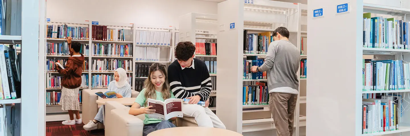 Students reading in the Heriot-Watt Malaysia library