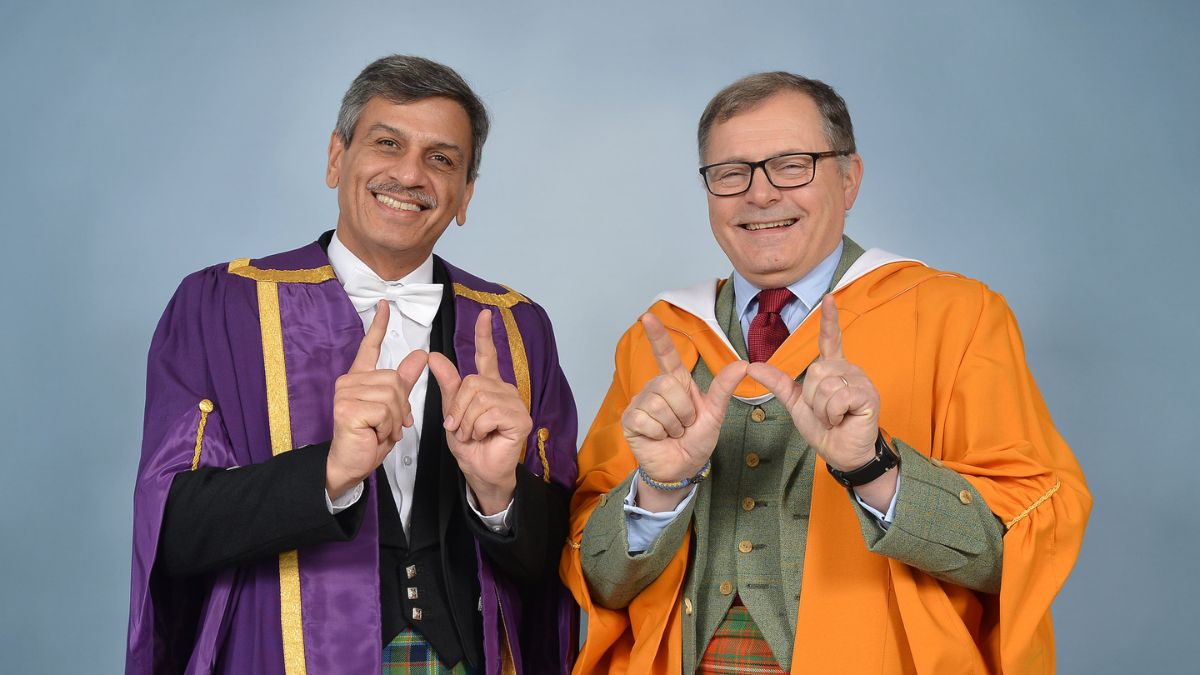 Professor Mushtak Al-Atabi and Charles Hay in graduation robes