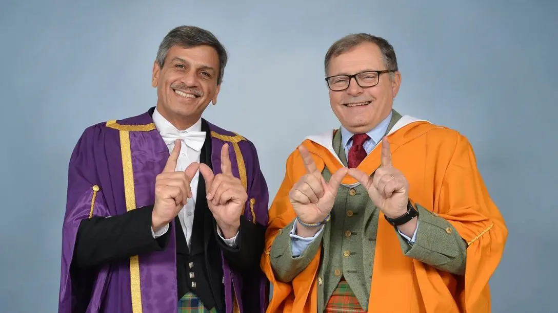 Professor Mushtak Al-Atabi and Charles Hay in graduation robes
