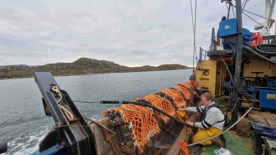 A researcher test a new fishing gear on a boat