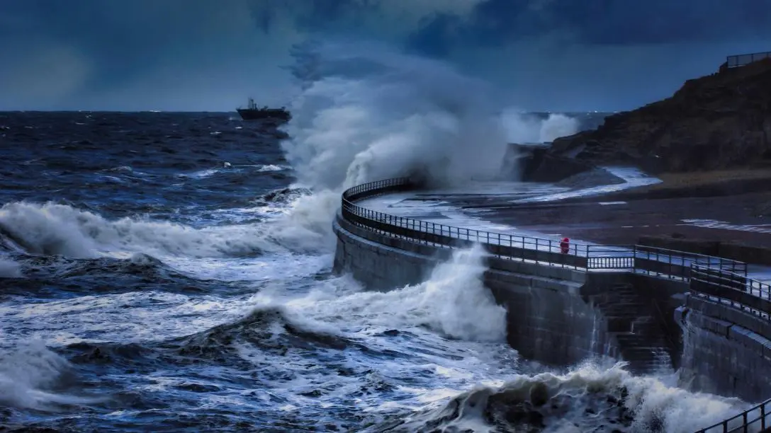 Waves crashing on a sea wall
