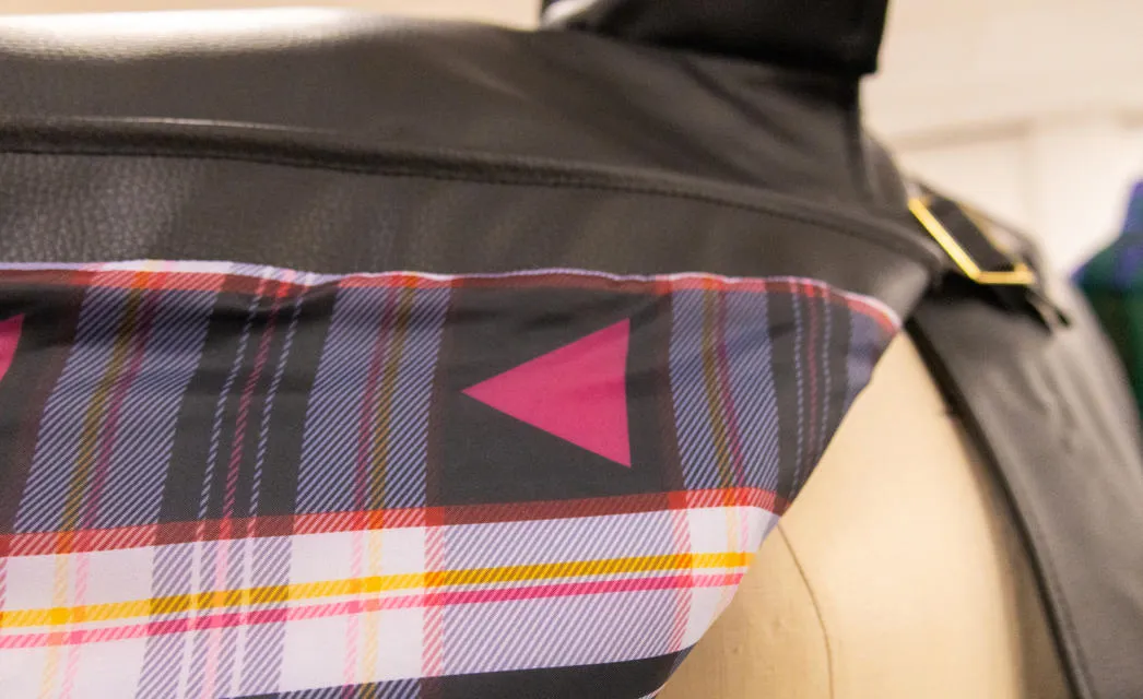 A detail of Craig’s tartan, on the lining of his leather cape.