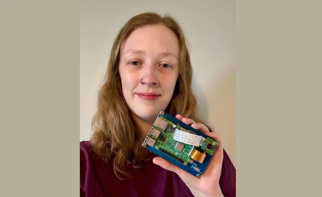 Tess Watt holding her new device. Tess Watt holding her new device.