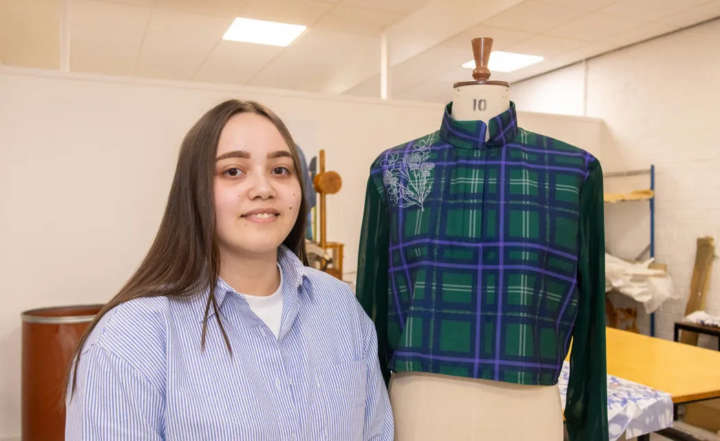 Kayleigh Wyllie with her embroidered tartan blouse. Kayleigh Wyllie with her embroidered tartan blouse.