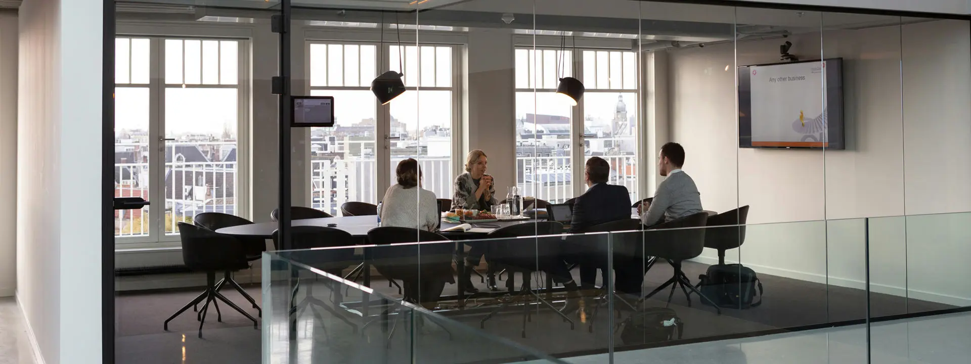 Business meeting. Photo by Rodeo Project Management Software on Unsplash.