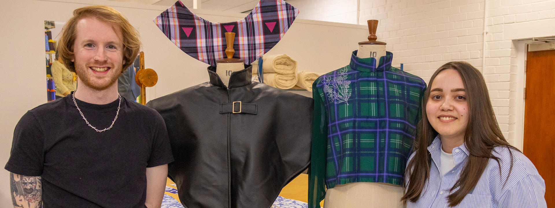 Fashion students Craig Taylor (left) and Kayleigh Wyllie with samples of their tartan designs.