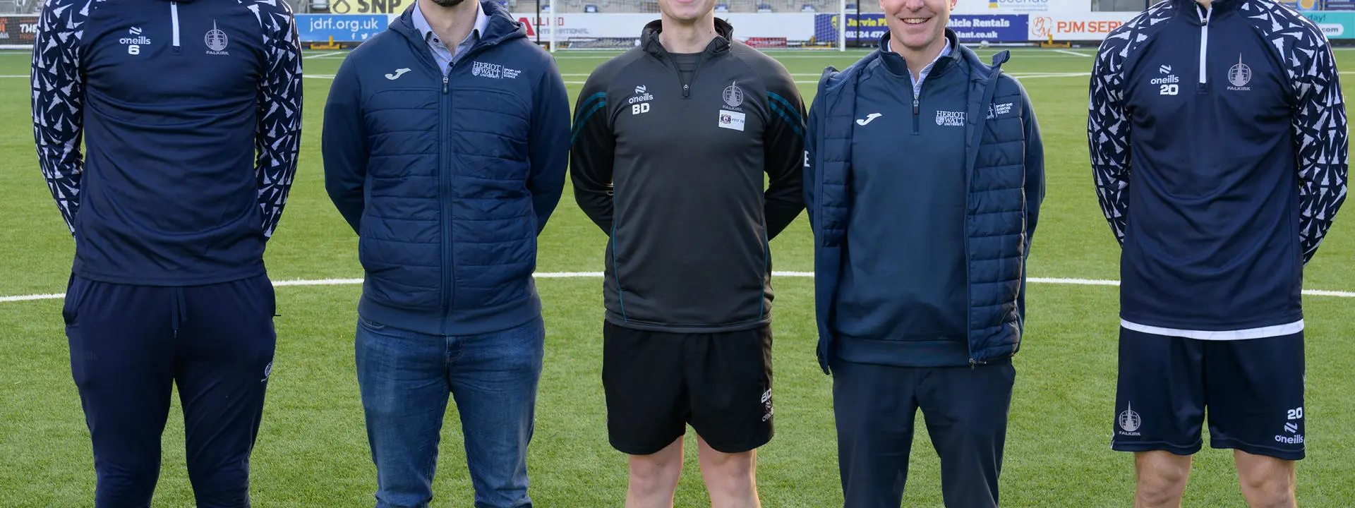 Group shot on the centre spot at the Falkirk stadium.