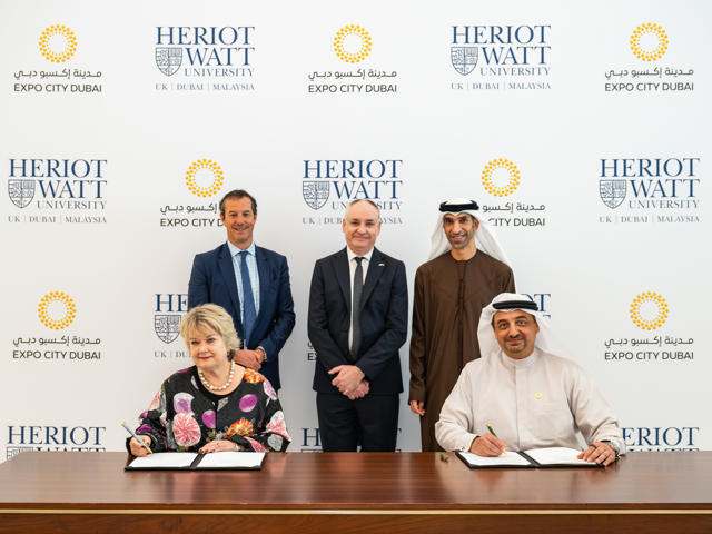 Image shows the key participants at the signing of the MOU in the UAE.