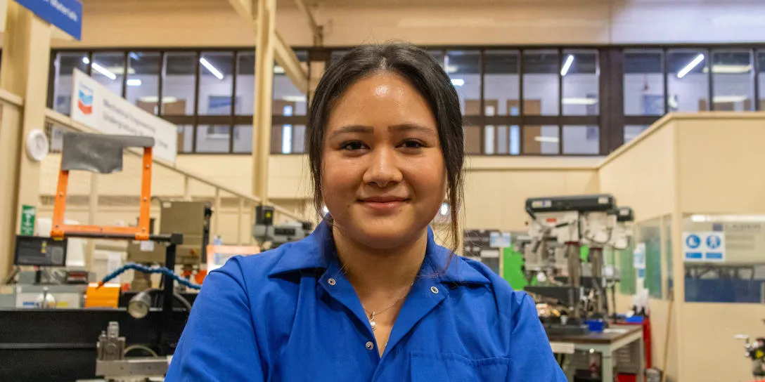 Student Uriel facing camera in lab