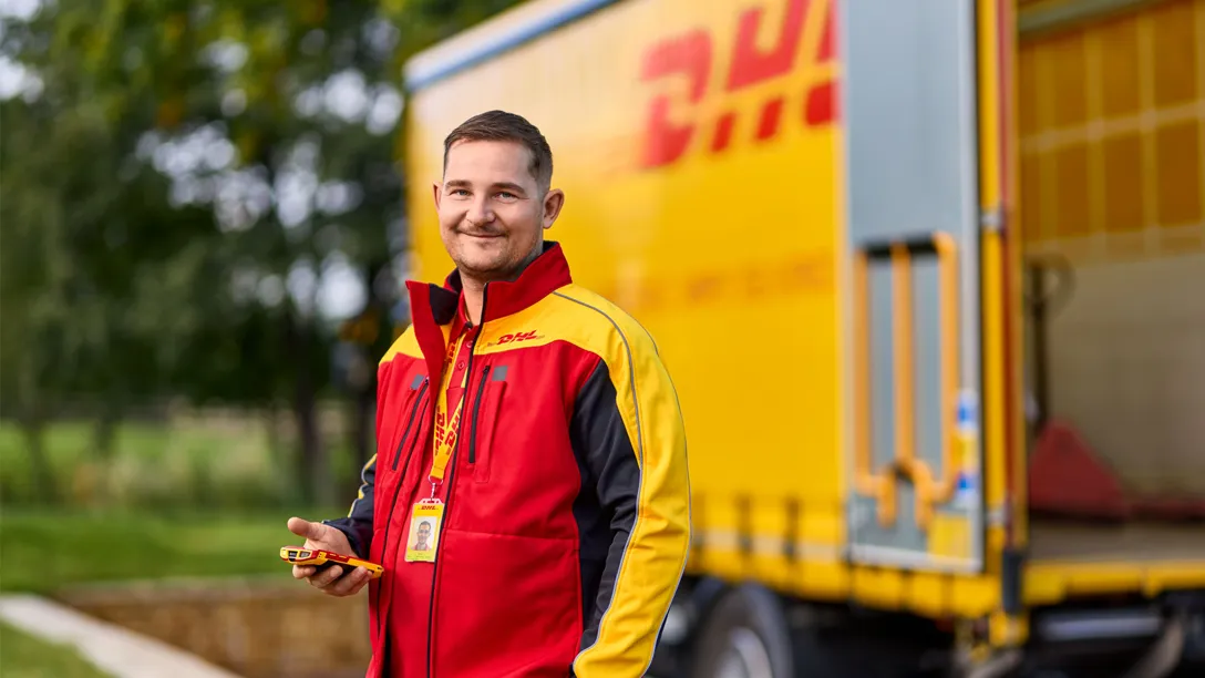 A DHL courier and HGV. Photo courtesy of DHL Express.