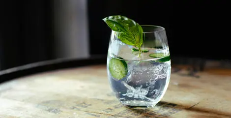 A glass of gin and tonic. Photo by Devin Berko on Unsplash.