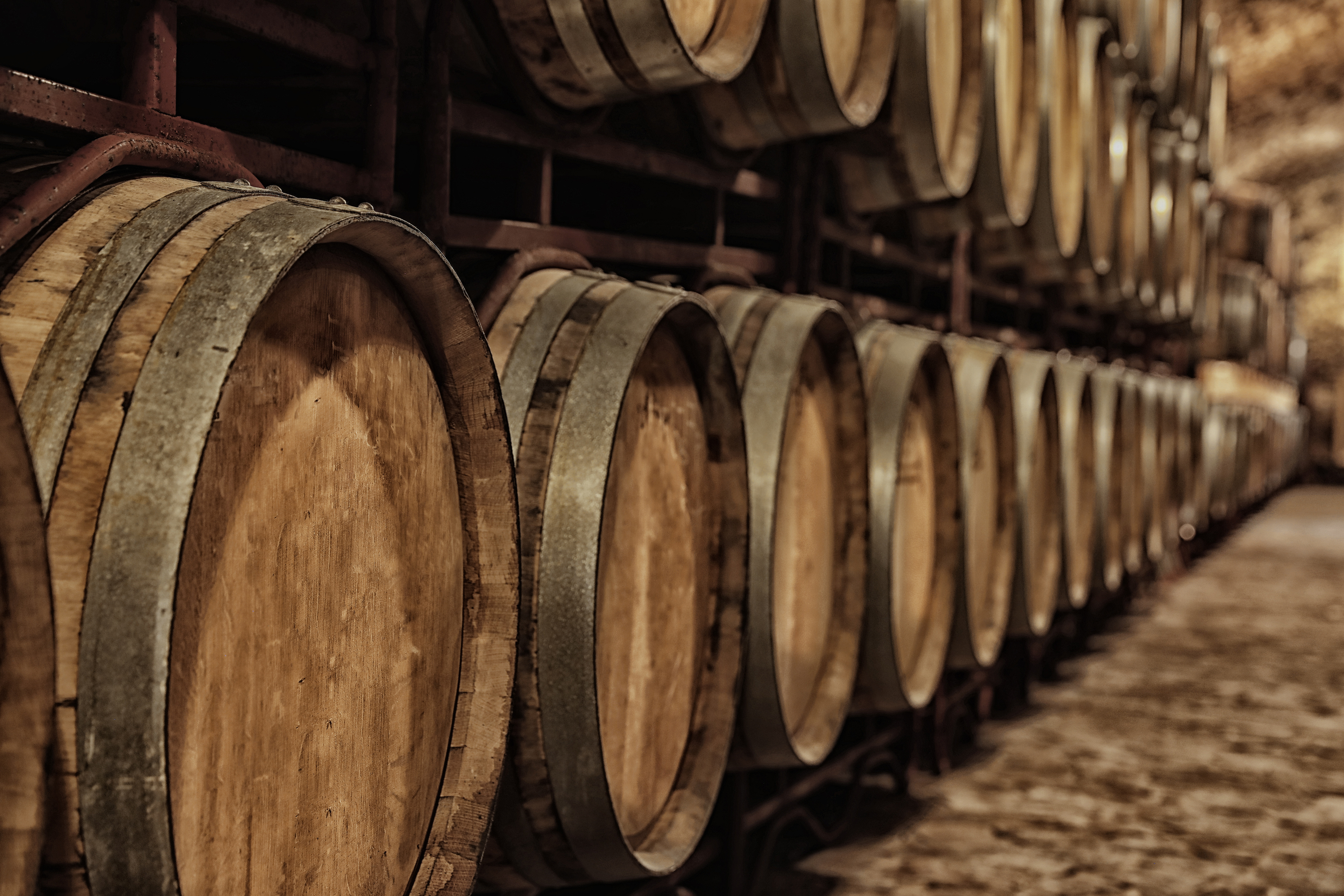 a line of whisky barrels