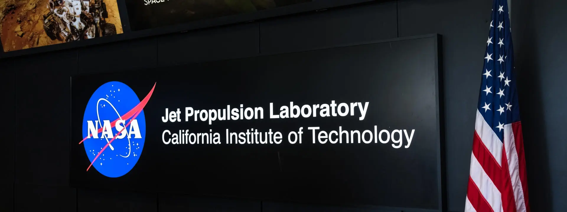 A digital screen at the Jet Propulsion Lab, California Institute of Technology displaying NASA logo