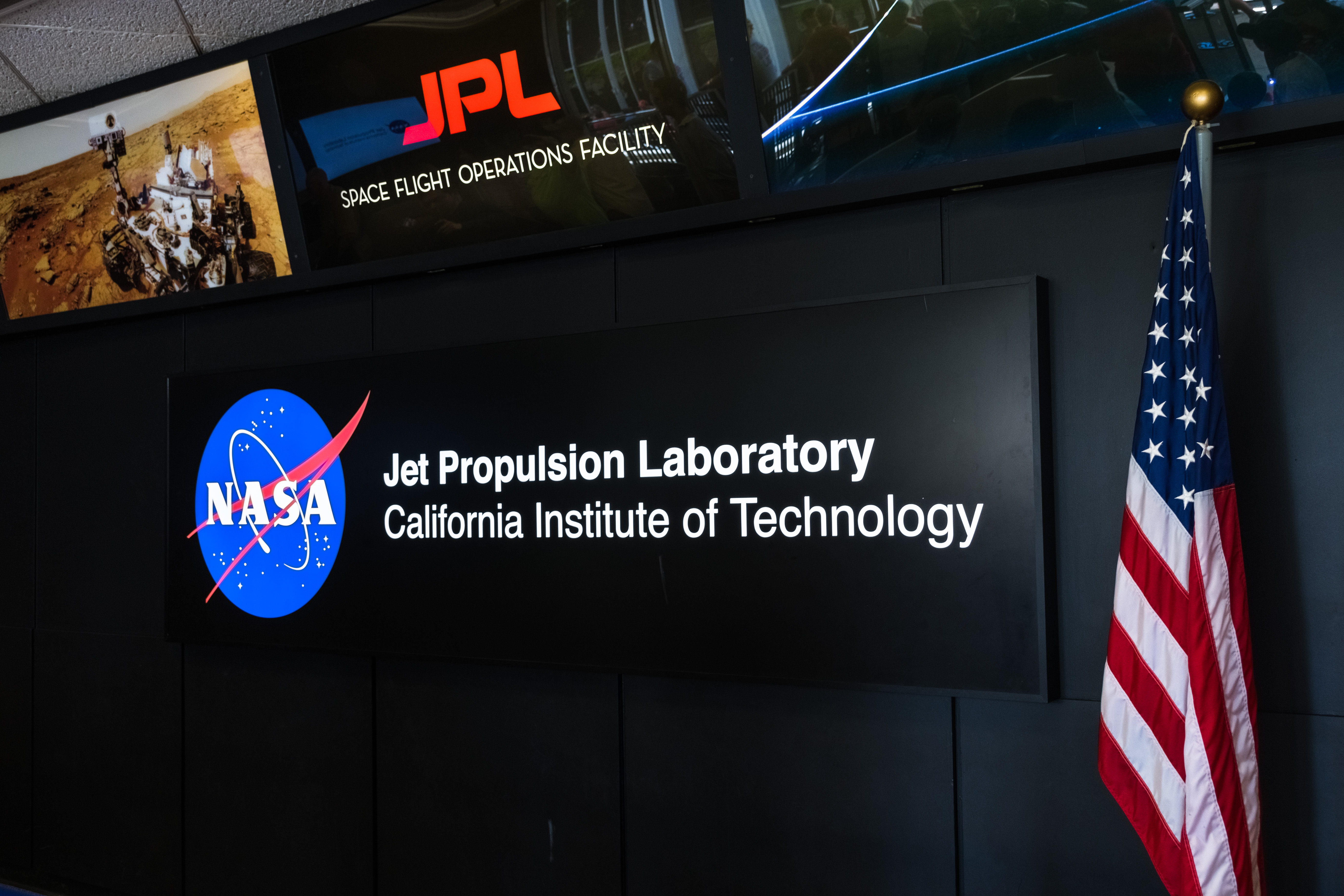 A digital screen at the Jet Propulsion Lab, California Institute of Technology displaying NASA logo
