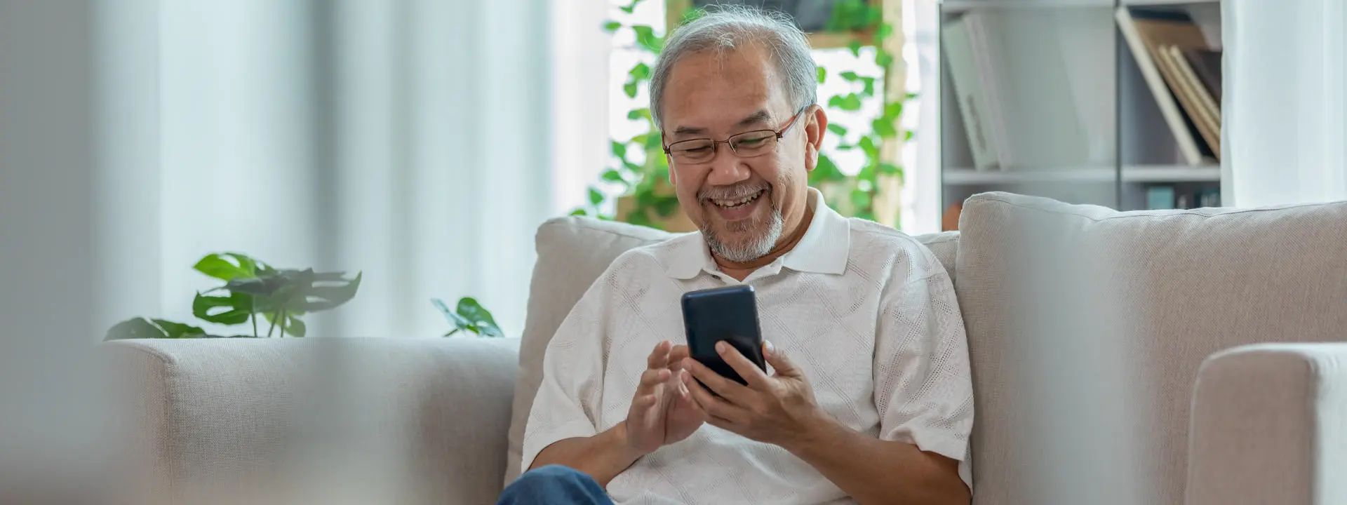 A person sitting using a mobile phone.