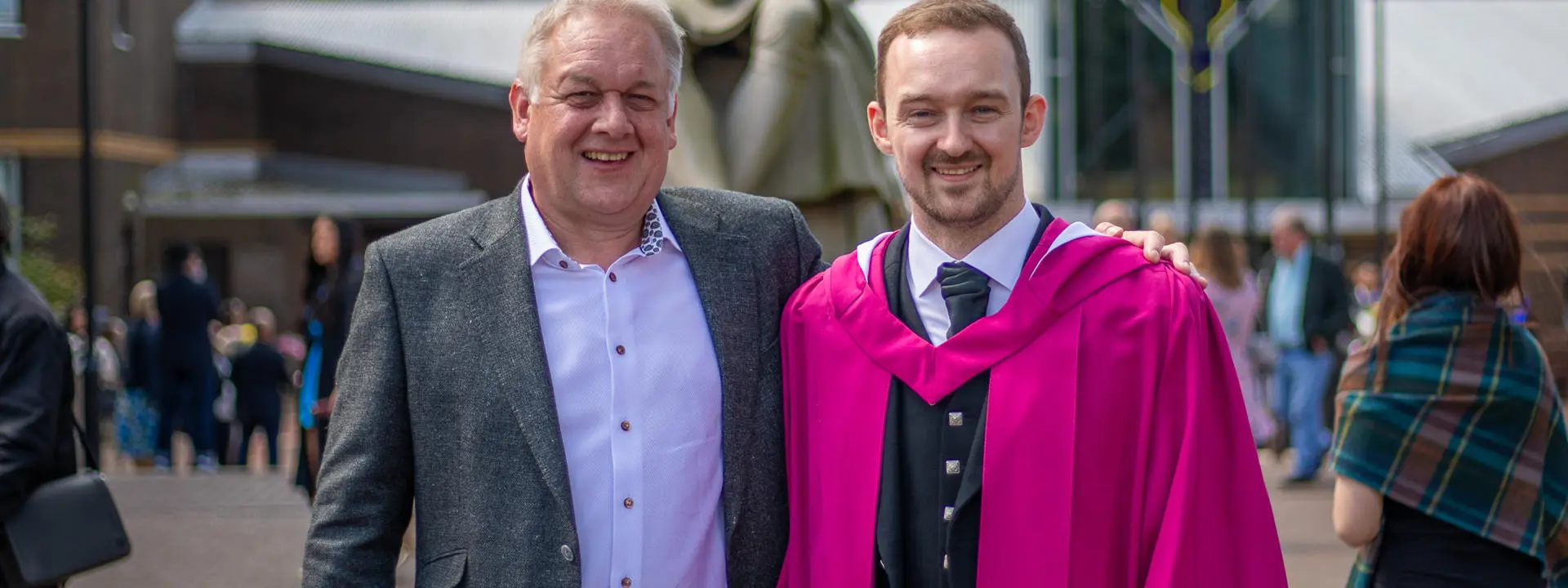 Angus Addlesee in his graduation gown with his father, Robert.
