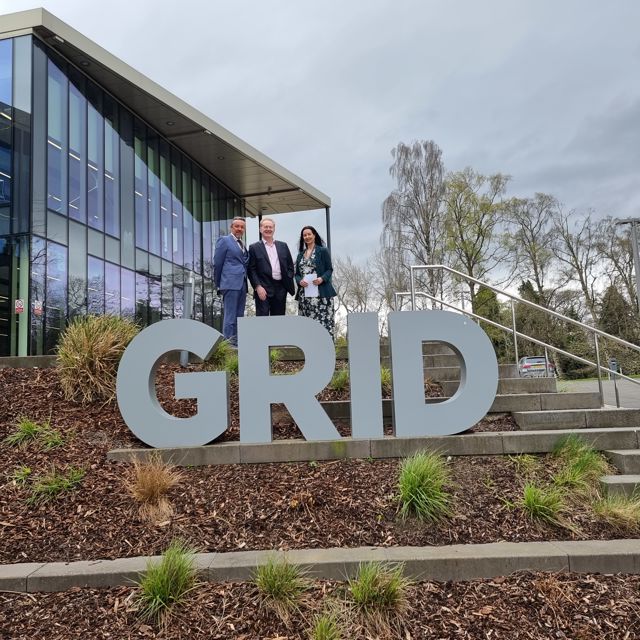 The memorandum was signed at Heriot-Watt's GRID building Three people stand behind the Heriot-Watt University Global Research Innovation and Discovery (GRID) sign in Edinburgh