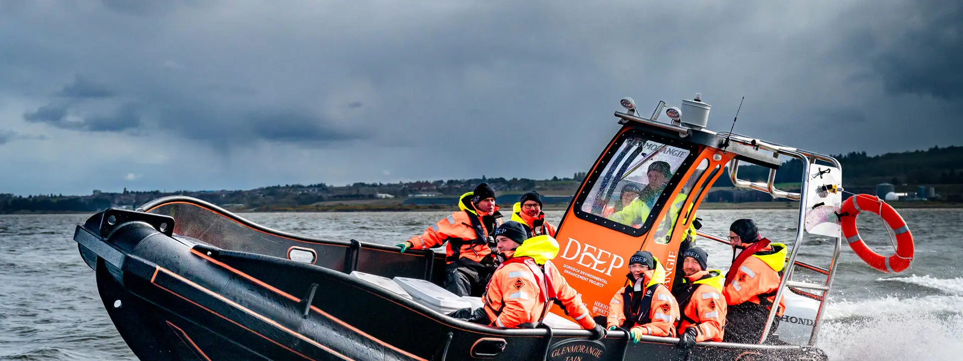 DEEP Boat on Dornoch Firth with passengers.