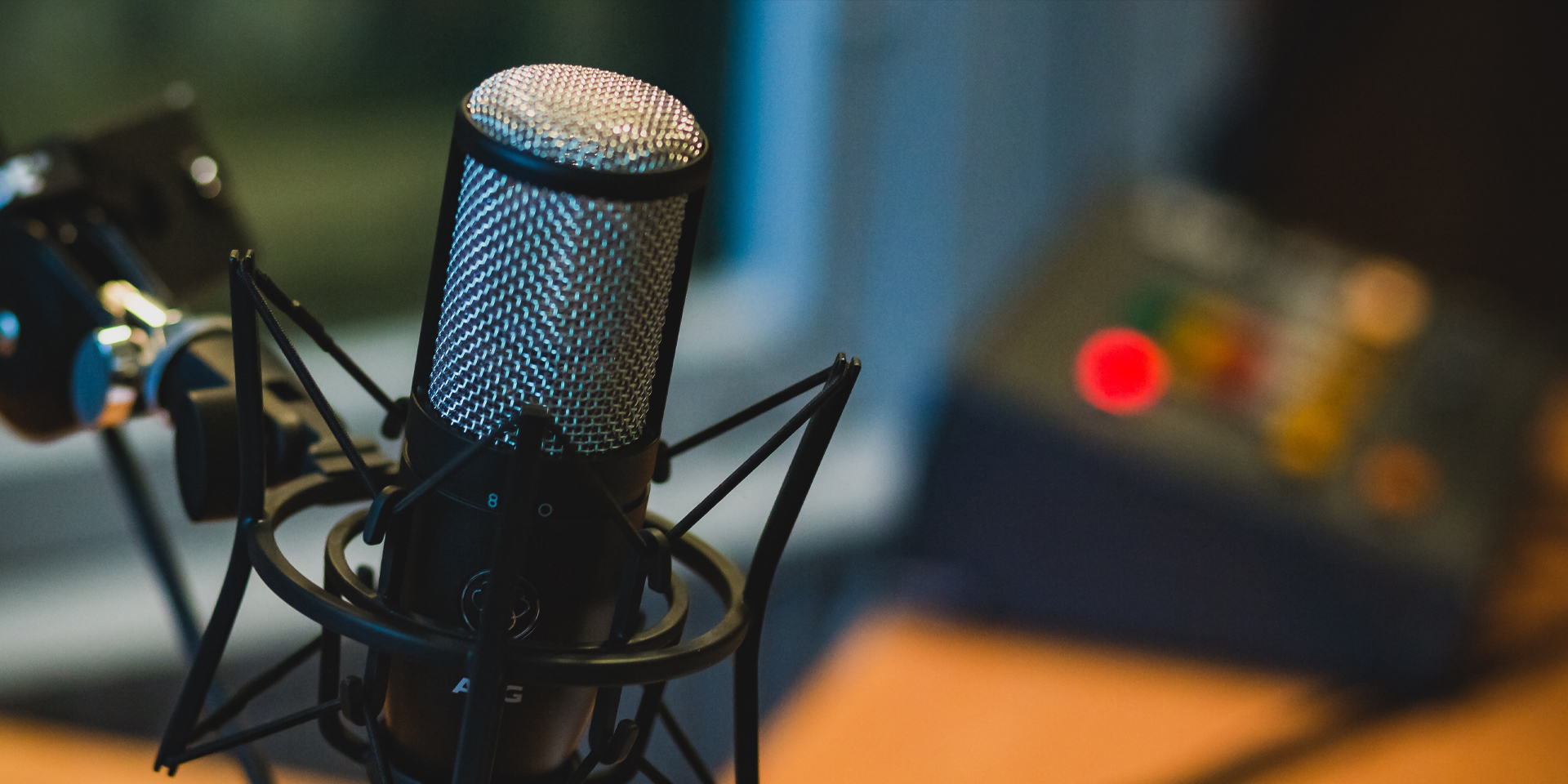 Close up of a microphone and recording equipment.