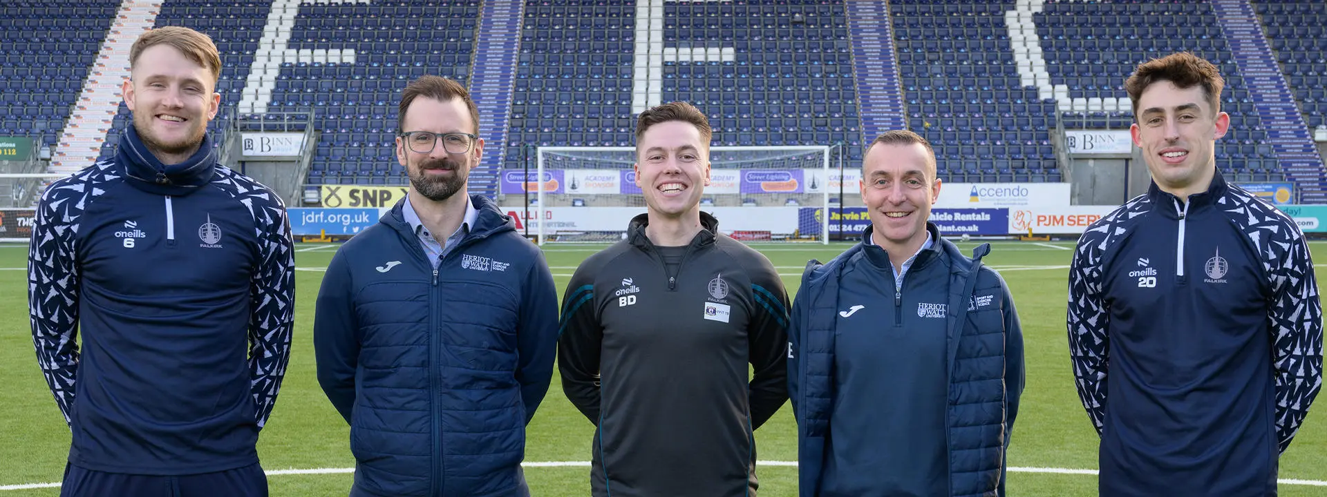 Group shot on the centre spot at the Falkirk stadium.