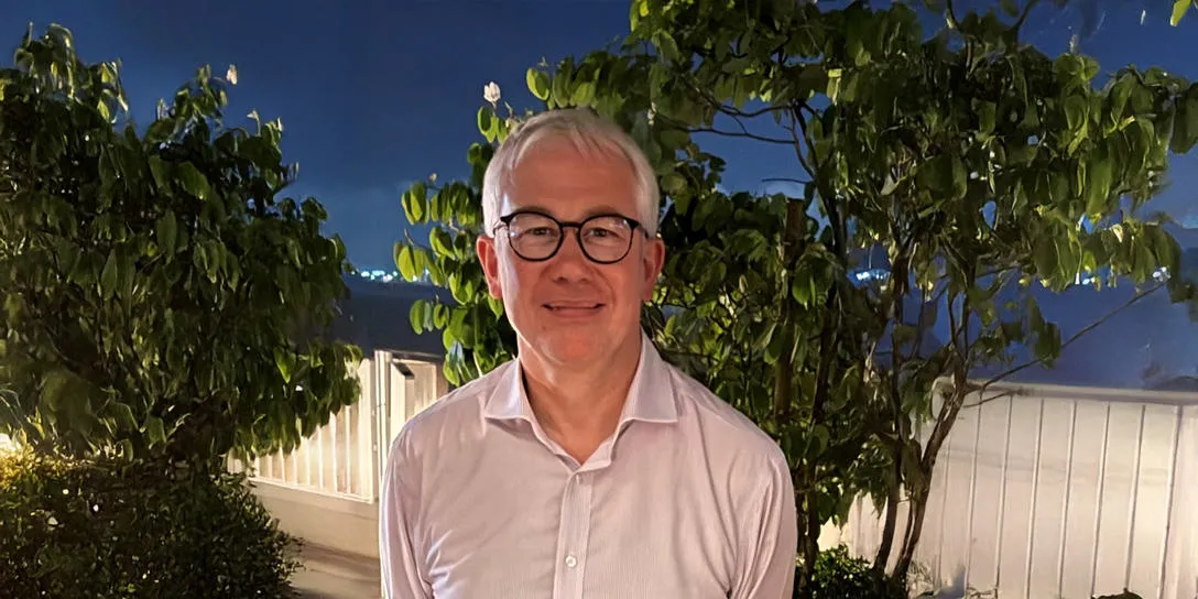 head and shoulders Professor Russell Cowburn FRS with trees and night sky background