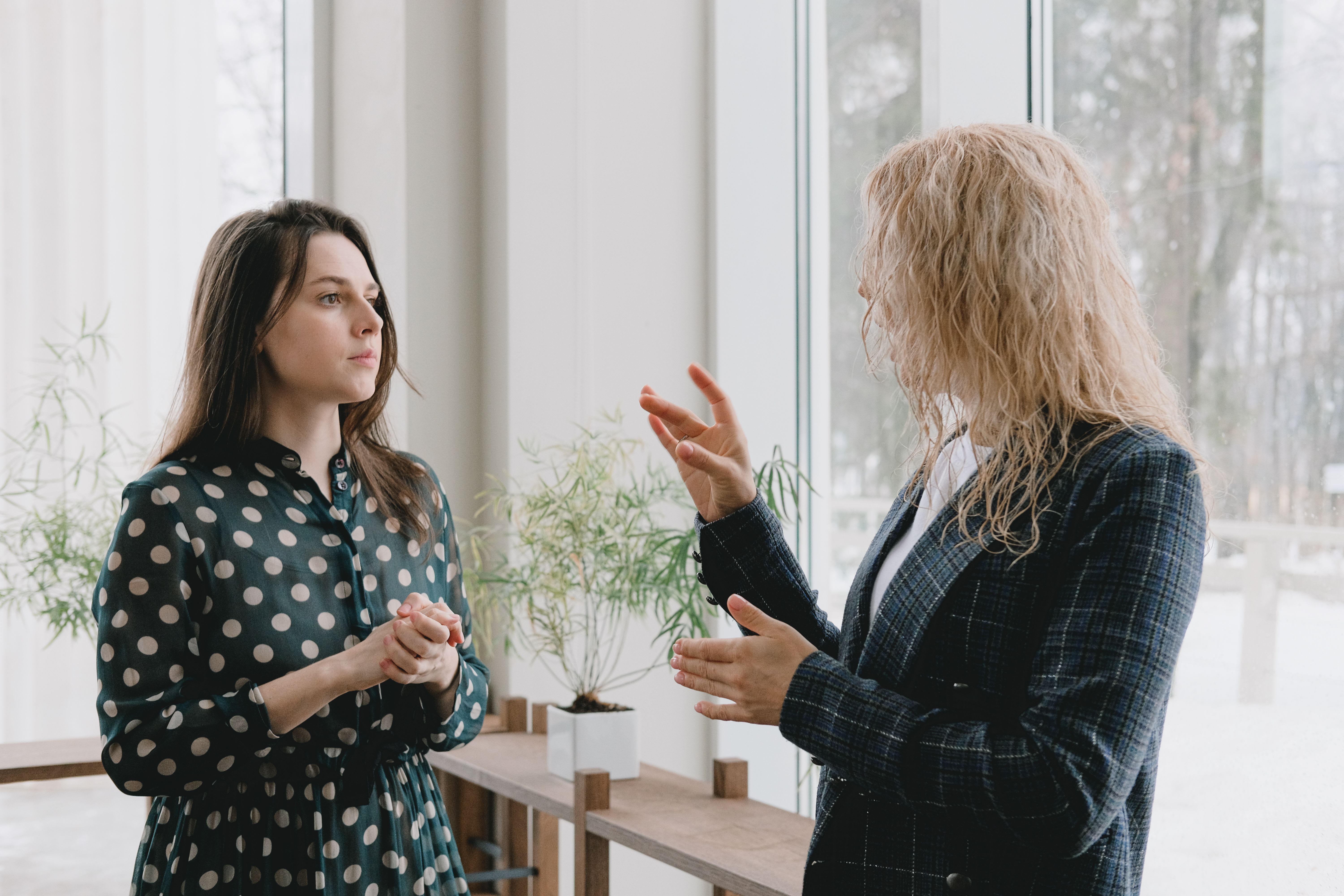 Two women using BSL.