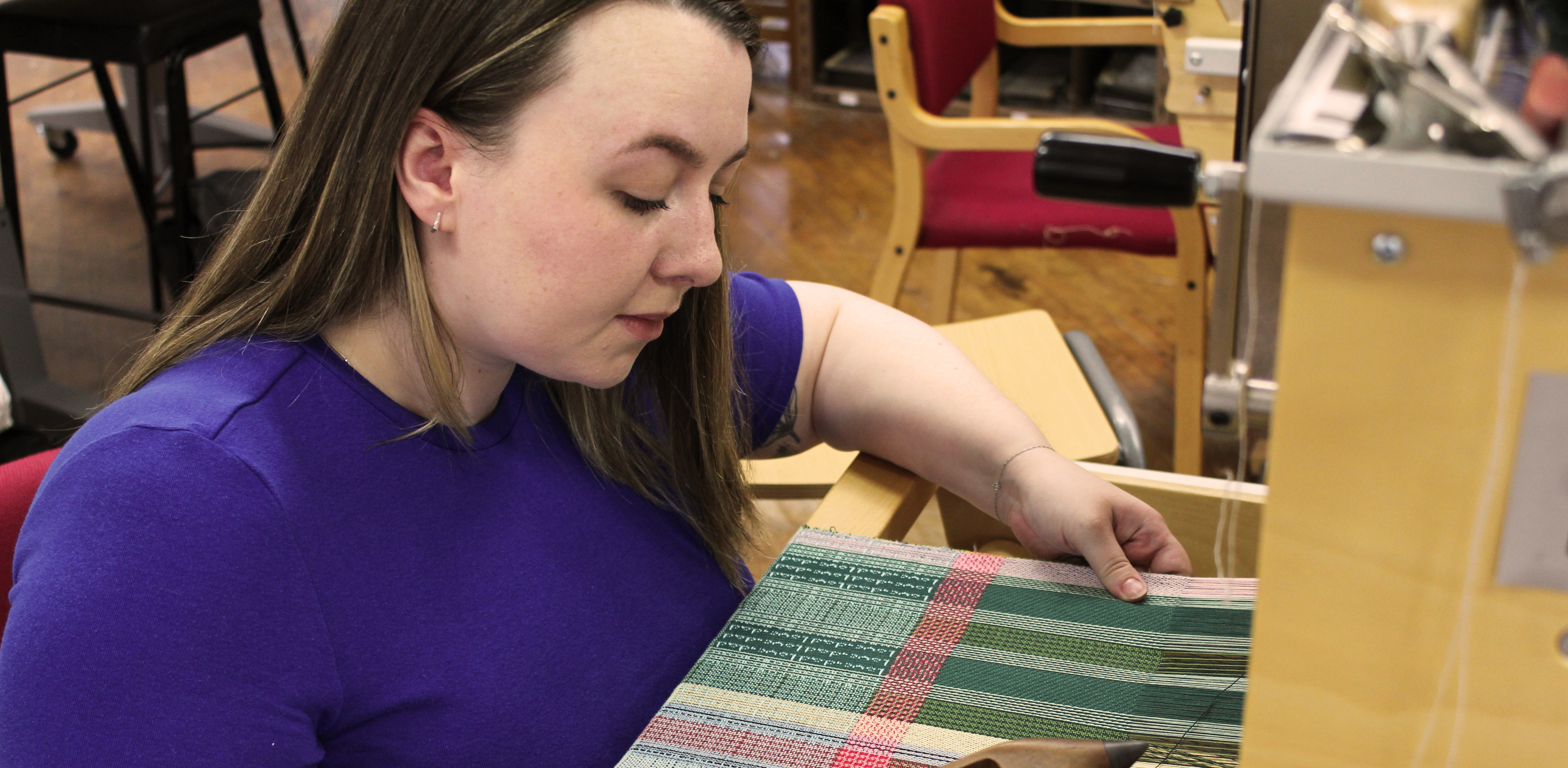 MA Fashion and Textiles Design postgraduate Rebecca Welsh working on her textile designs. 