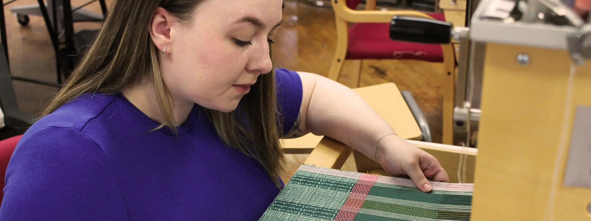 MA Fashion and Textiles Design postgraduate Rebecca Welsh working on her textile designs.