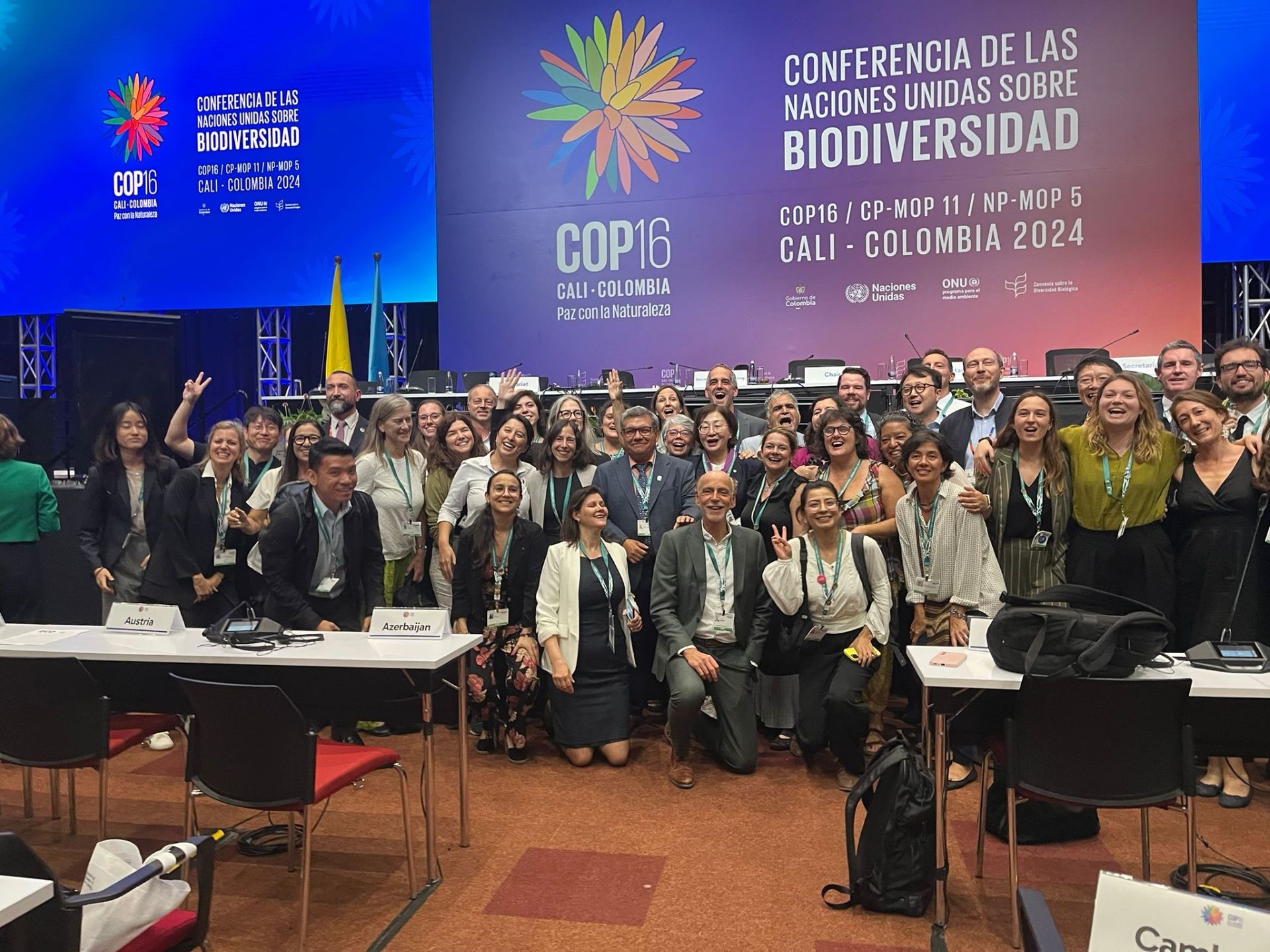 A large group of people posing at the United Nations Biodiversity Conference (COP16) in Cali, Colombia, 2024.
