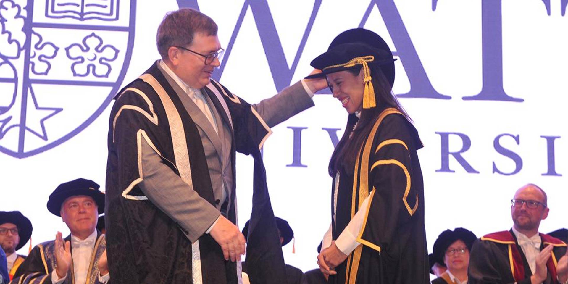 Datuk(Dr) Nicol Ann David receives congratulations from Professor Richard A. Williams.