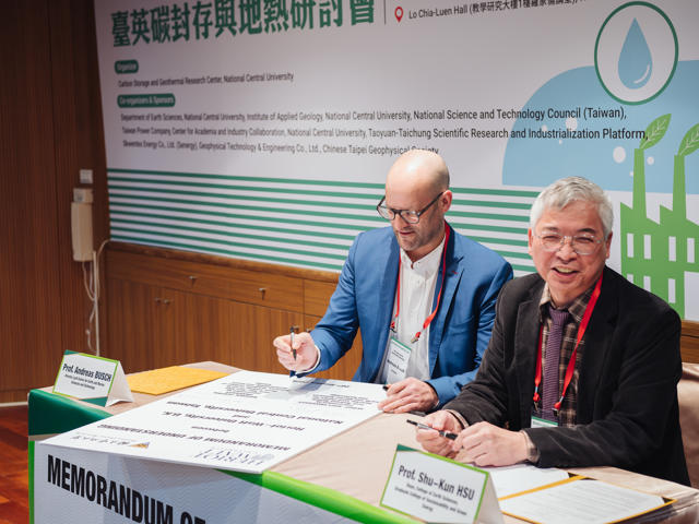 Two professors sign a memorandum of understanding