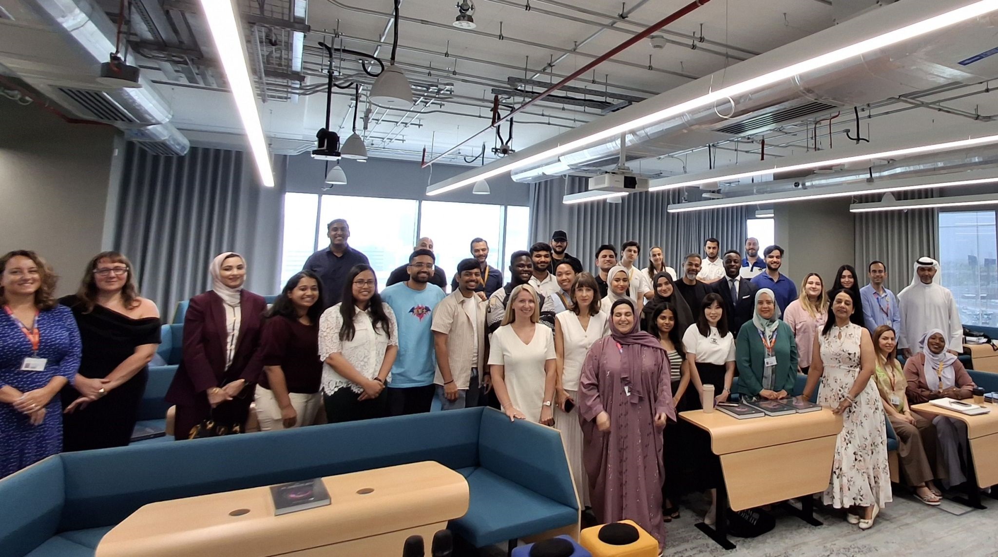 EBS global incubator Cohort 3 alongside incubator staff inside a classroom  