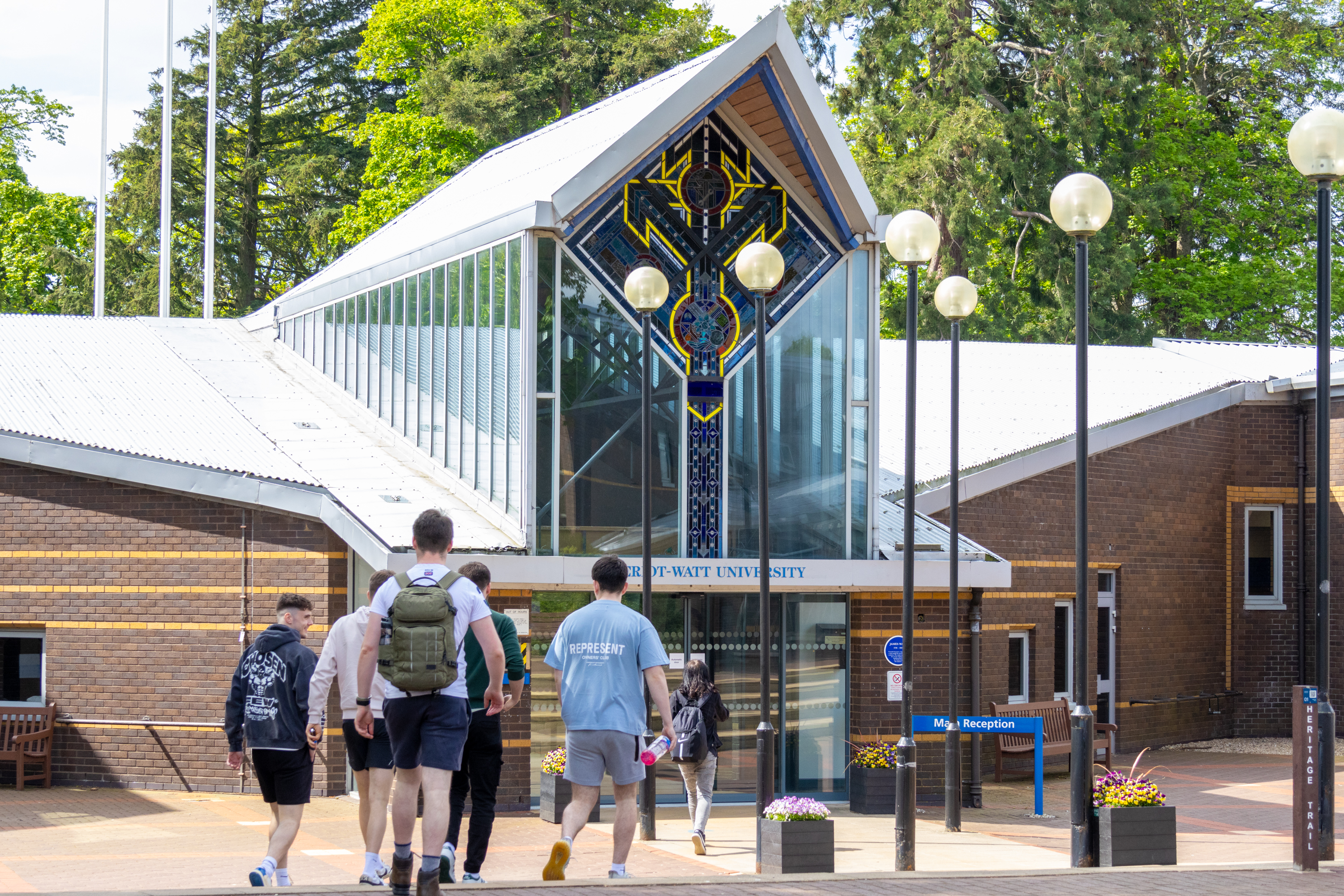 People walking to the entrance of the Edinburgh campus