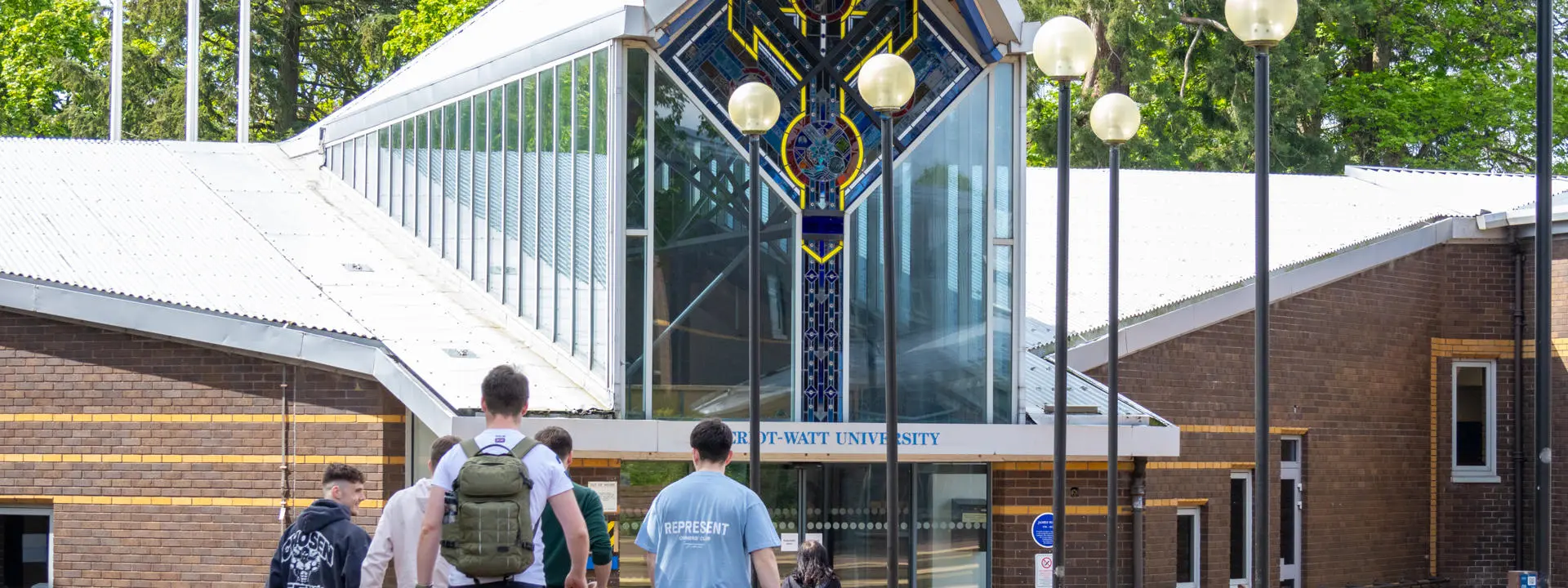 People walking to the entrance of the Edinburgh campus