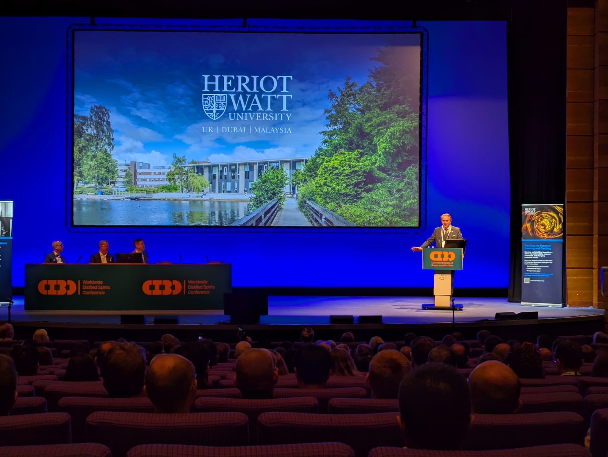 Professor Chris Turney on stage at the Worldwide Distilled Spirits Conference 2026