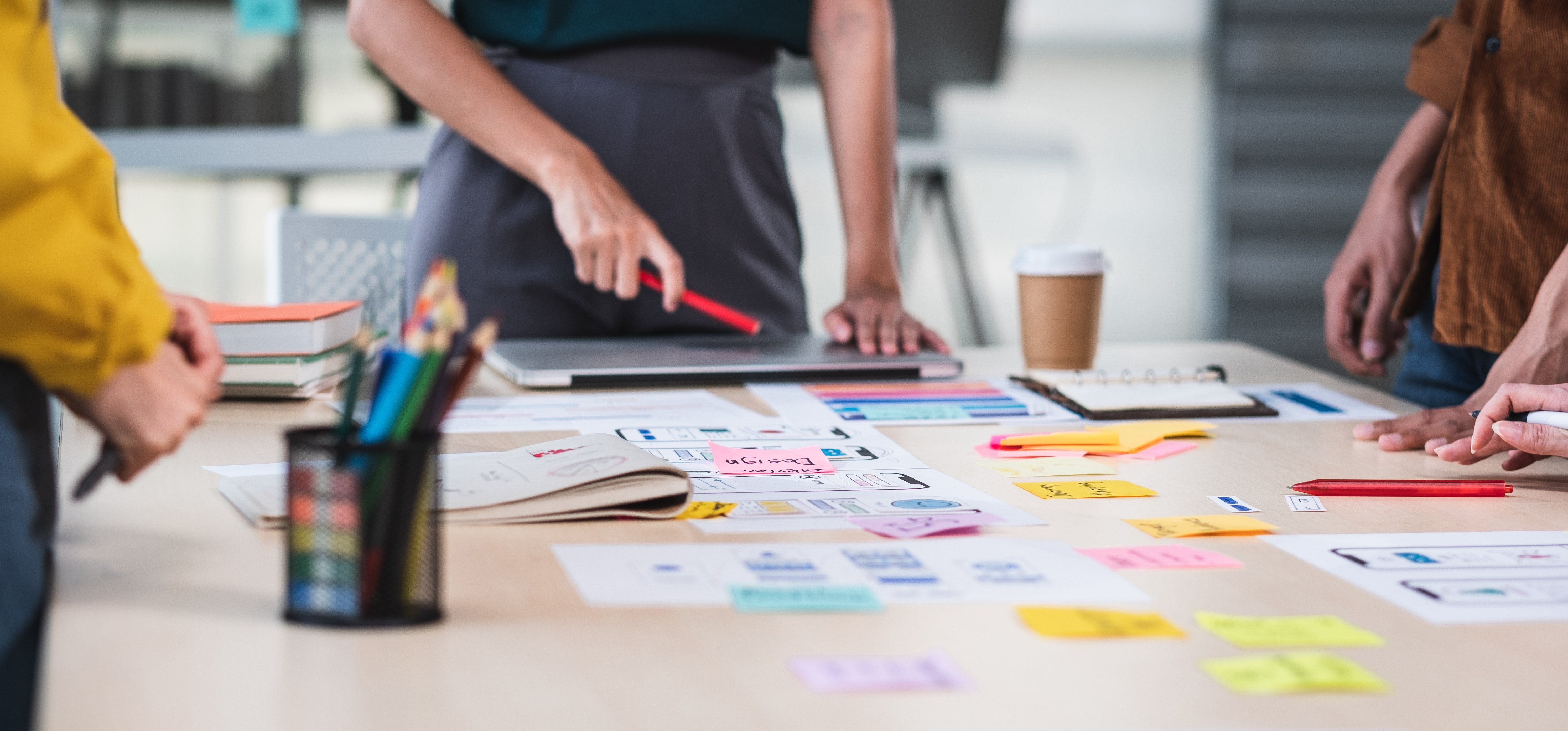 Close up ux developer and ui designer brainstorming