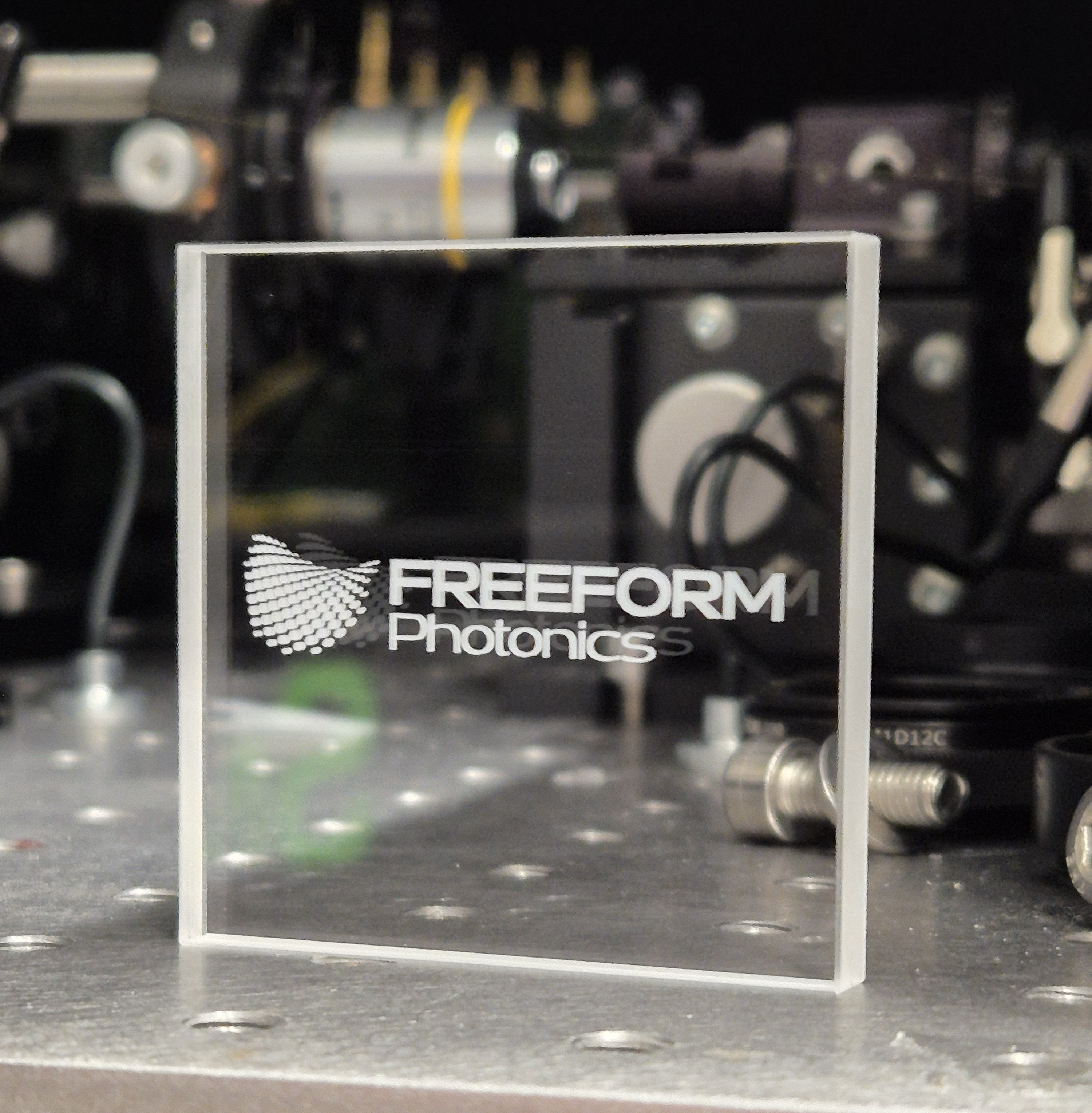 logo of Freeform Photonics shown on Perspex.