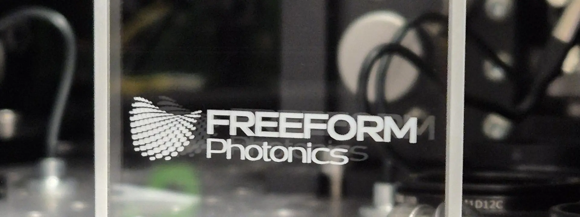 logo of Freeform Photonics shown on Perspex.