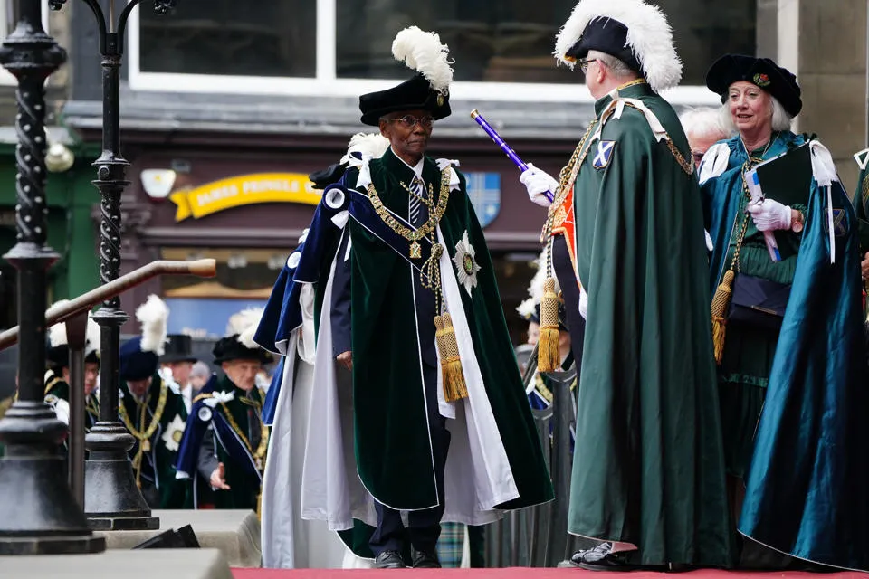 Professor Emeritus Sir Geoff Palmer receiving The Order of the Thistle. Professor Emeritus Sir Geoff Palmer receiving The Order of the Thistle.