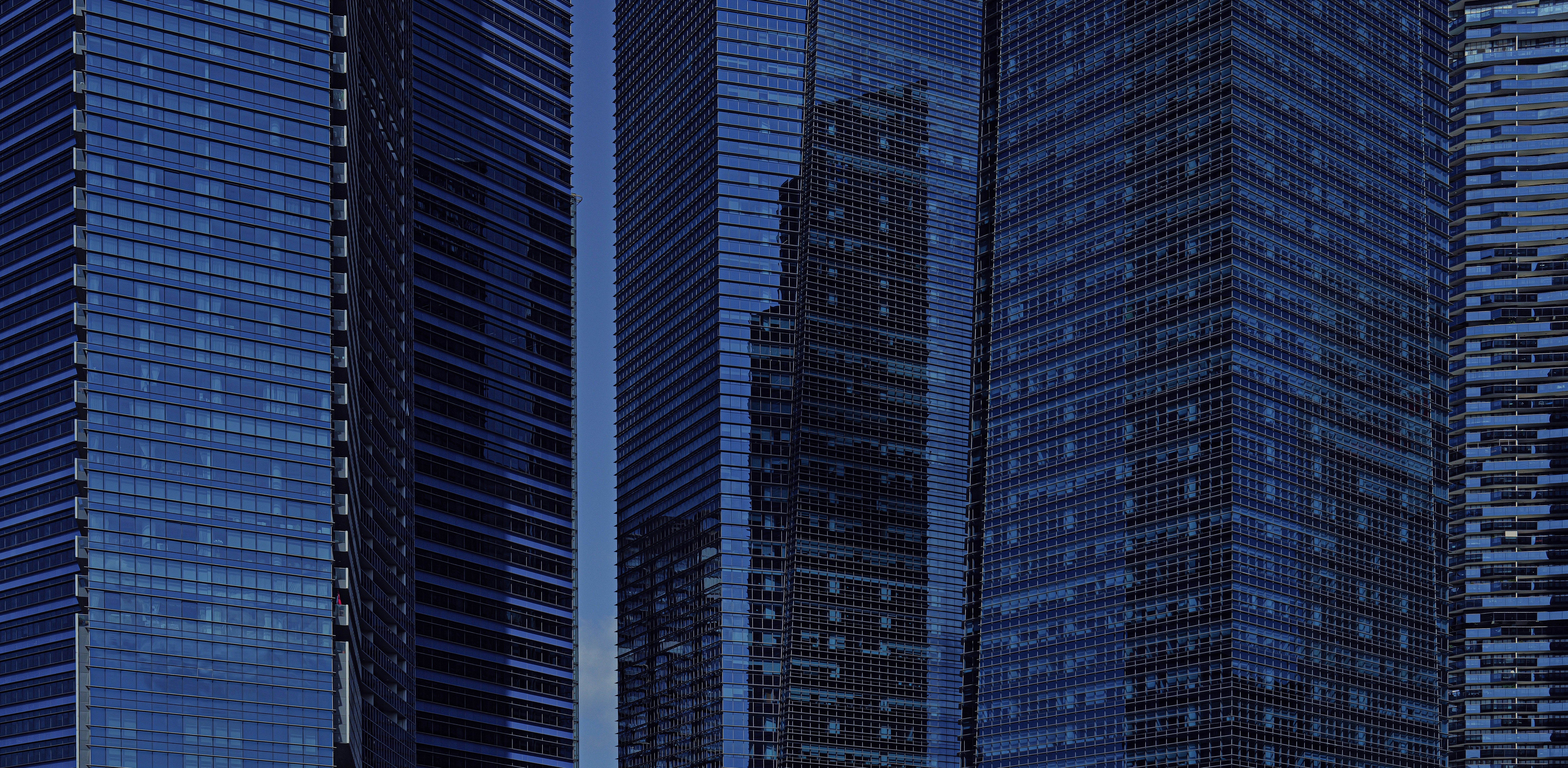 A horizontal view of glass buildings