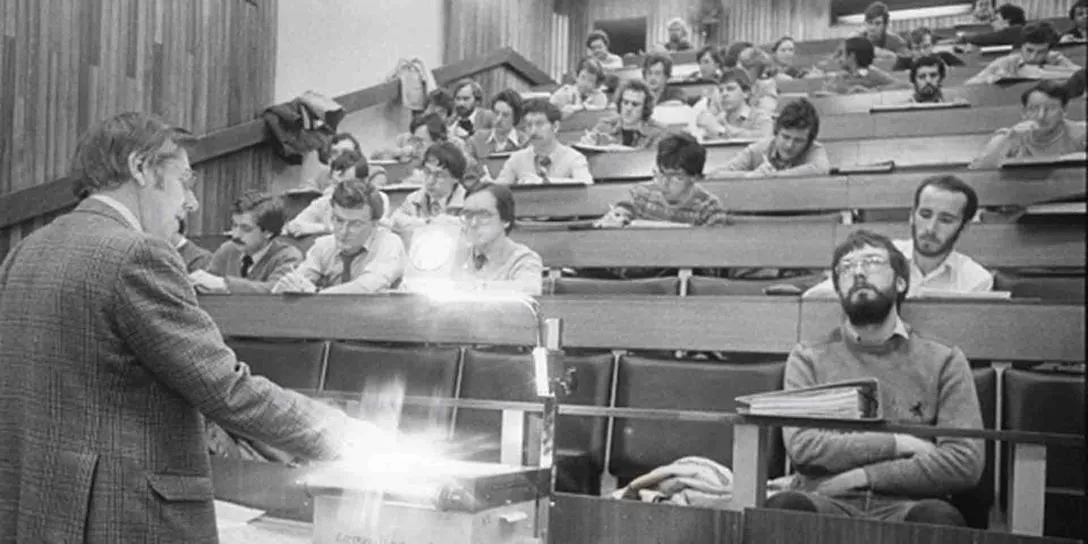 Black and white picture of students attending a lecture.