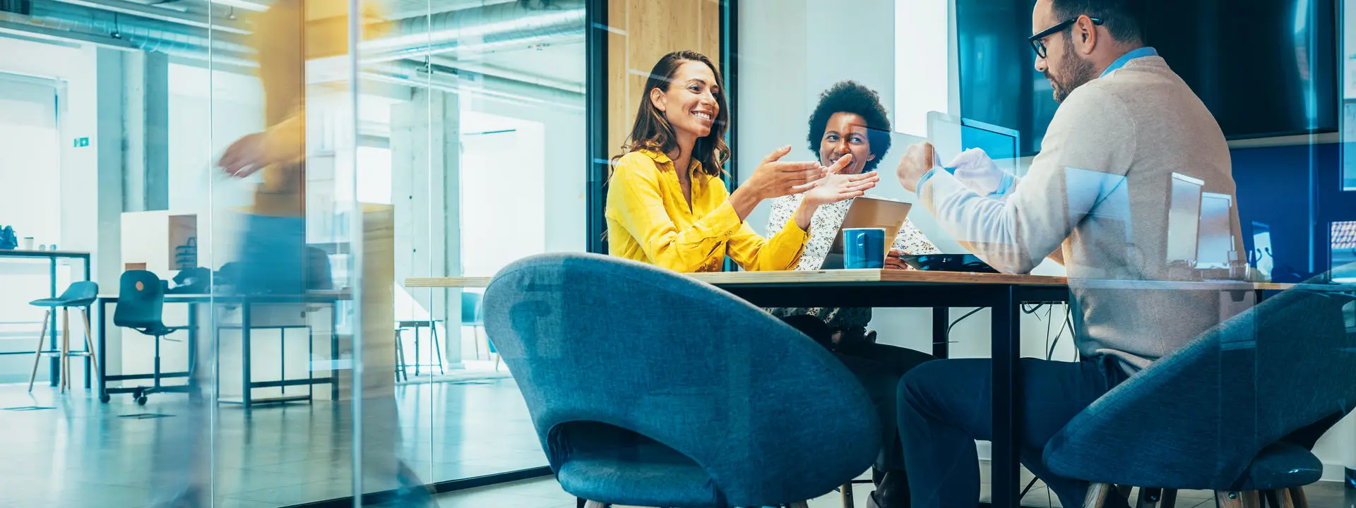 A group of professions in discussion at a conference table