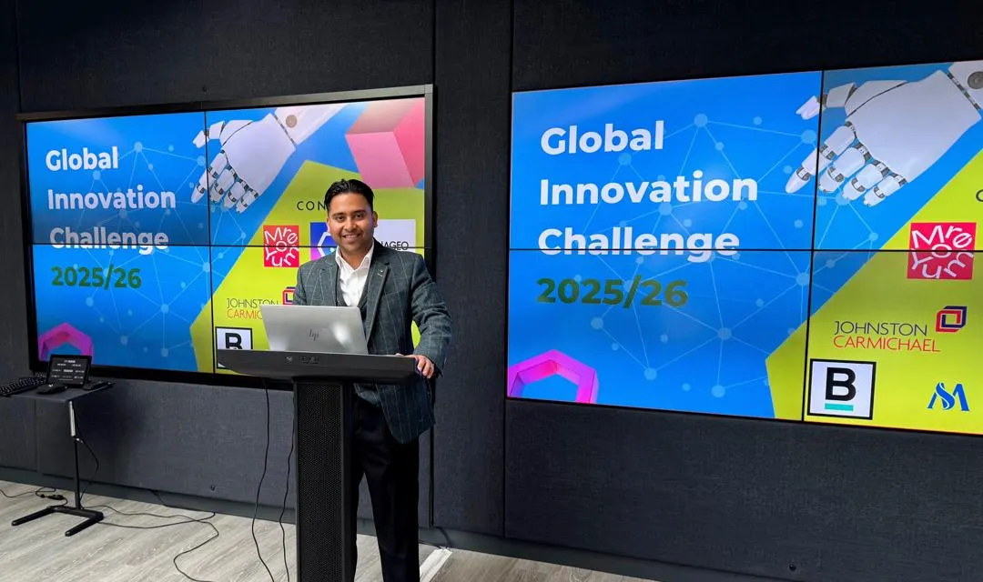 Programme Lead, Rafee Ahamed Enterprise executive behind a podium