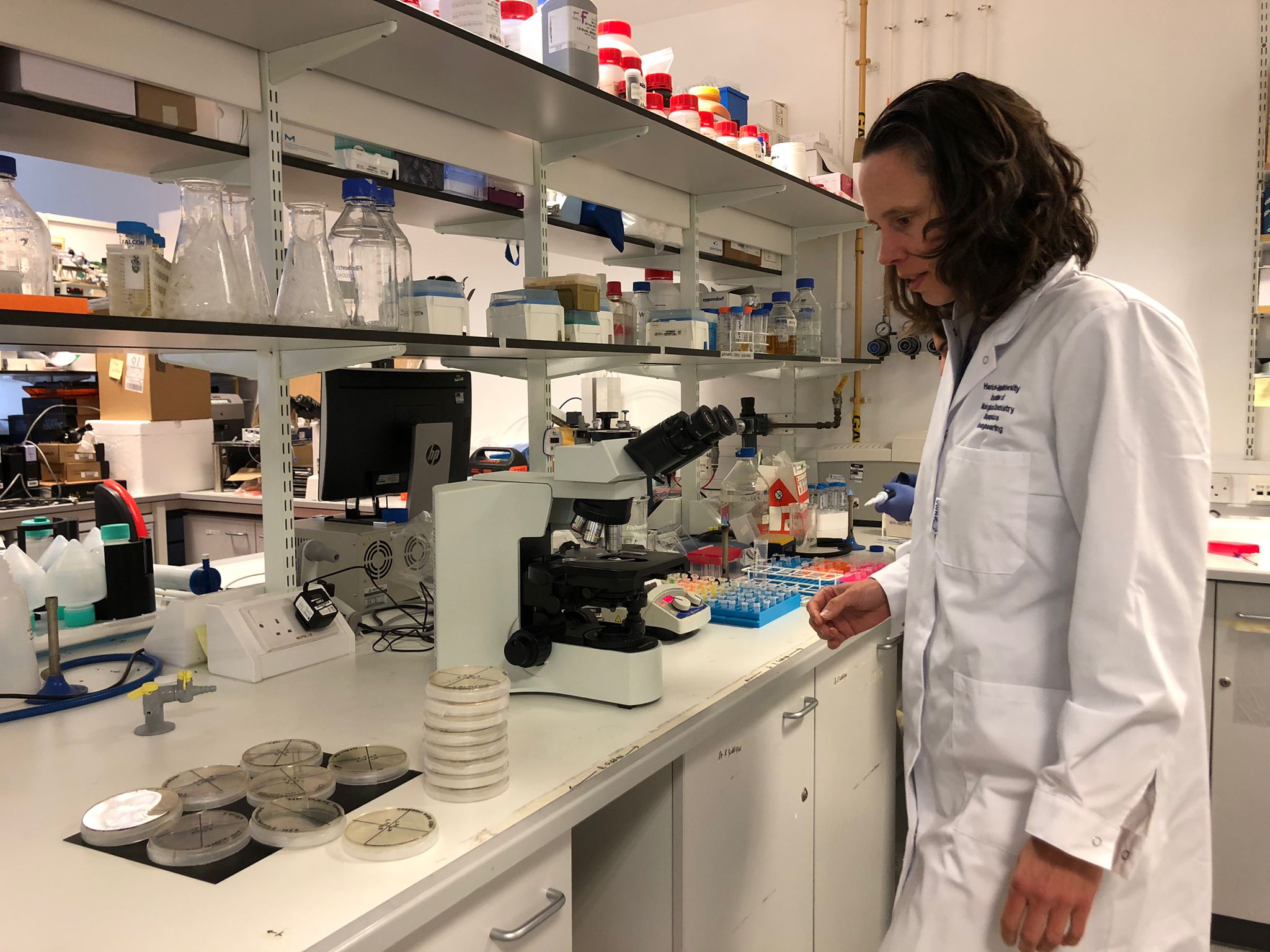 Professor Helen Bridle in a lab setting.