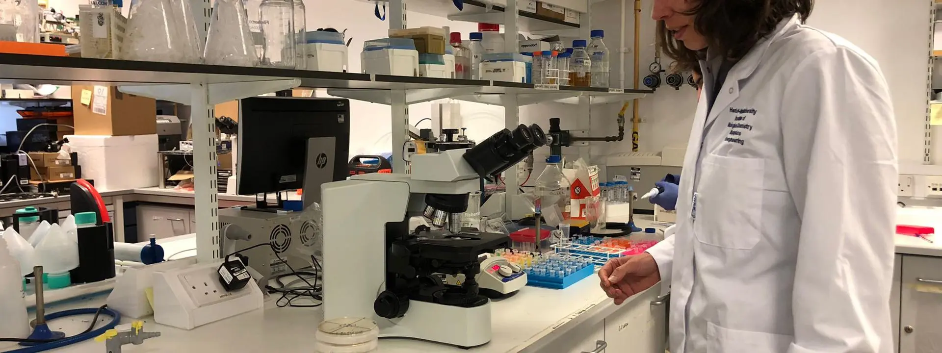 Professor Helen Bridle in a lab setting.