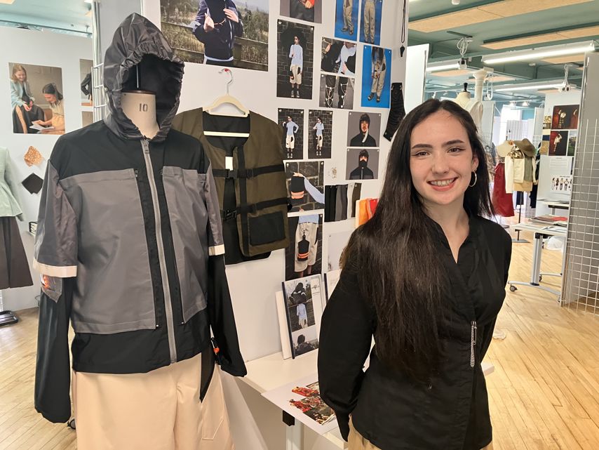 Marina Logan standing with her collection.