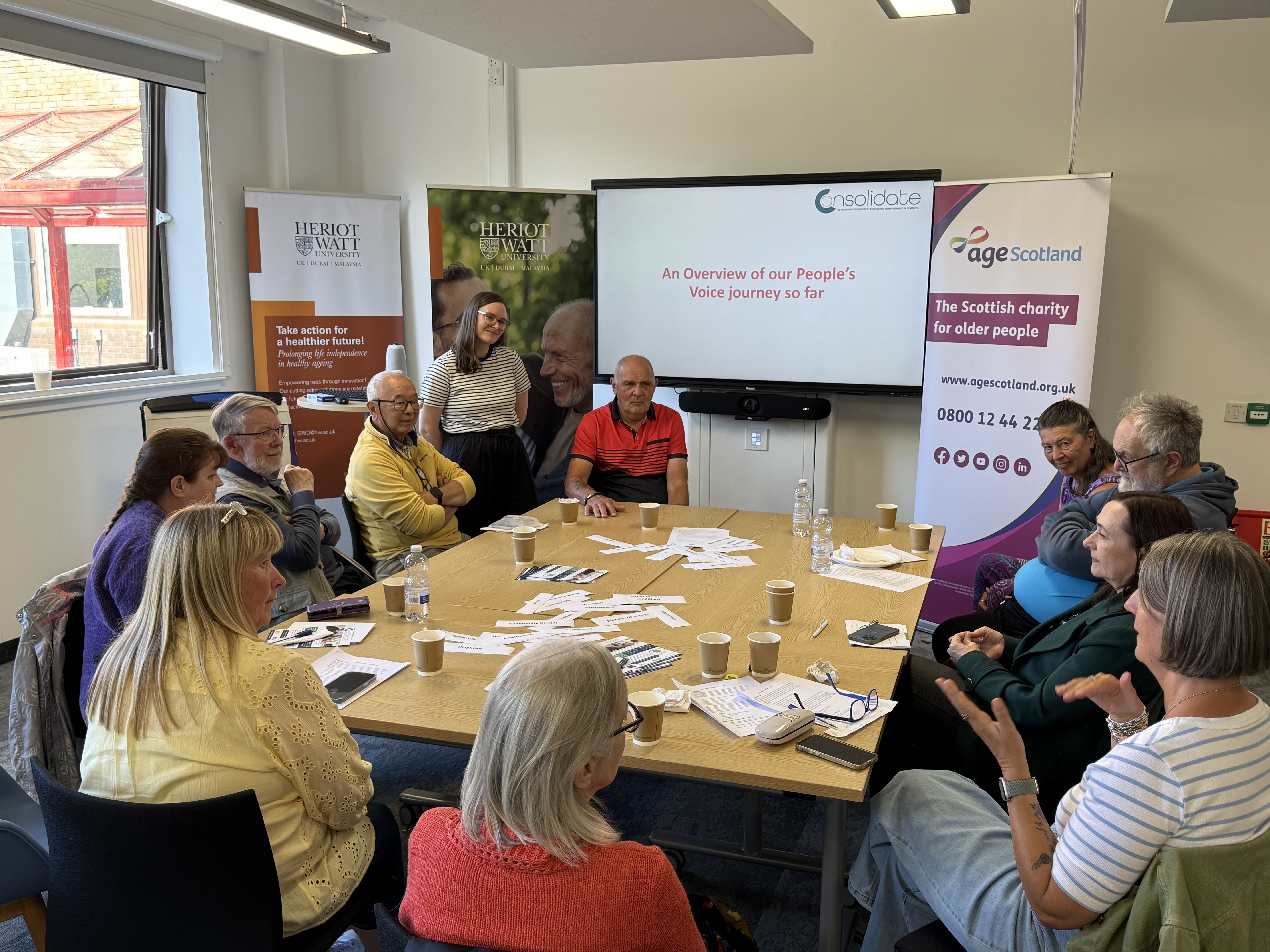 A diverse group of people engaging in a group discussion on lived experience 